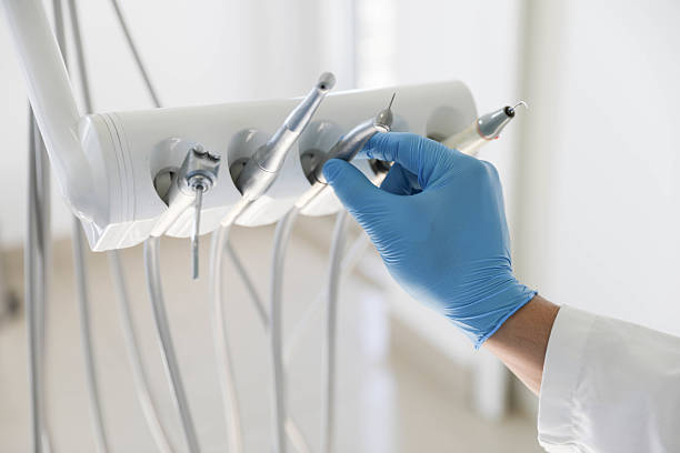 Professional Tooth Extraction technician working in Cleveland, TX
